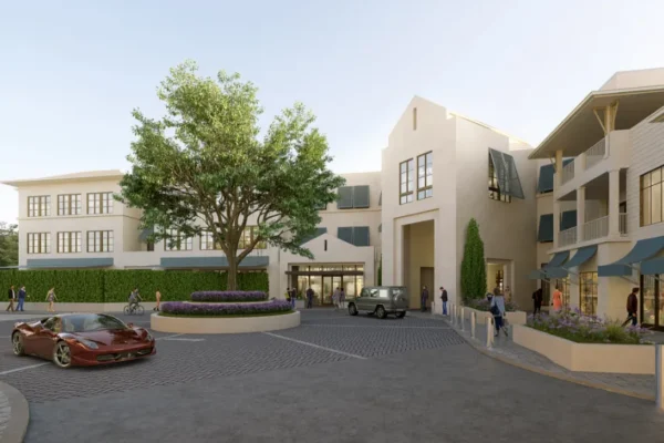 Modern apartments, courtyard, large tree, shops, people, parked cars.