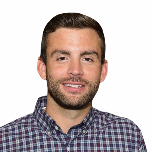 Smiling bearded man in plaid shirt on white background.